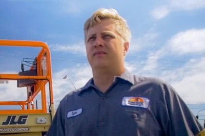 Man standing in front of construction equipment