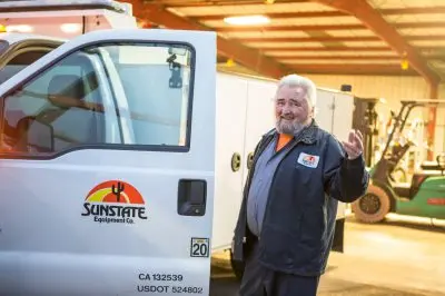 Person gesturing you to join as getting into a truck
