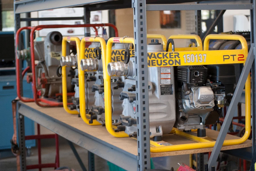 Gas-powered pumps on a shelf at Sunstate, ready for rental